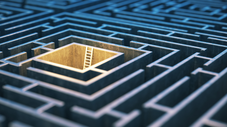 Staircase in the middle of the square maze with yellow neon lights Stock Photo